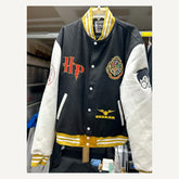 Front view of black cream and gold Harry Potter-themed varsity jacket size 2XL