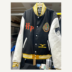 Front view of black cream and gold Harry Potter-themed varsity jacket size 2XL