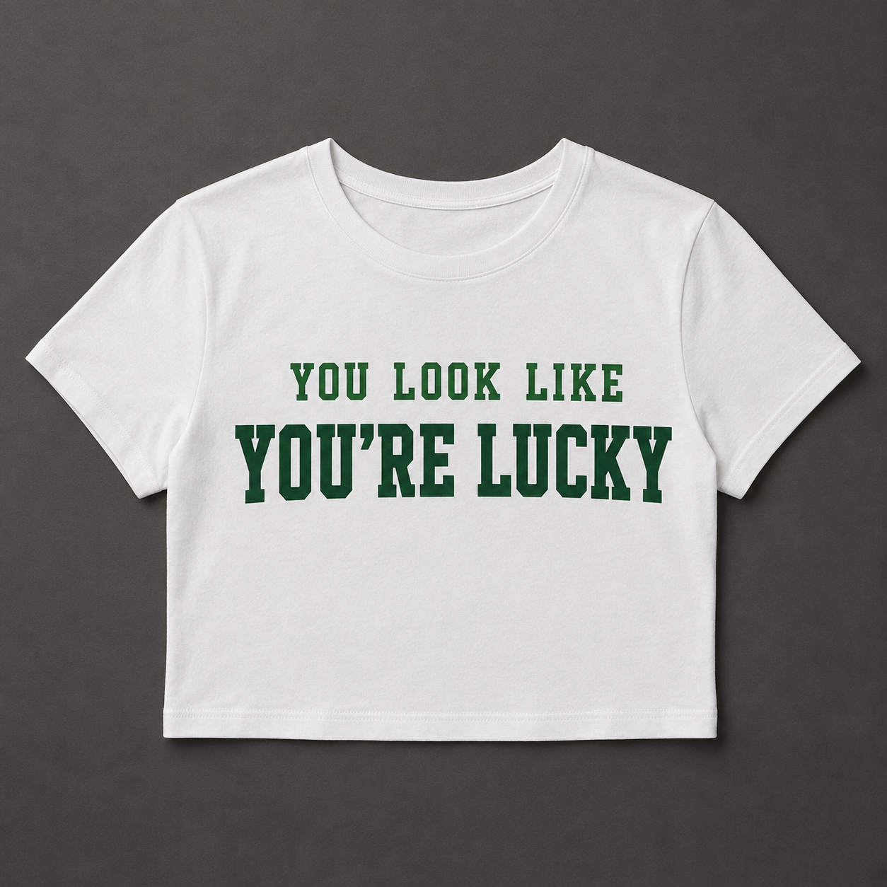White cropped baby tee with green You Look Like You're Lucky design